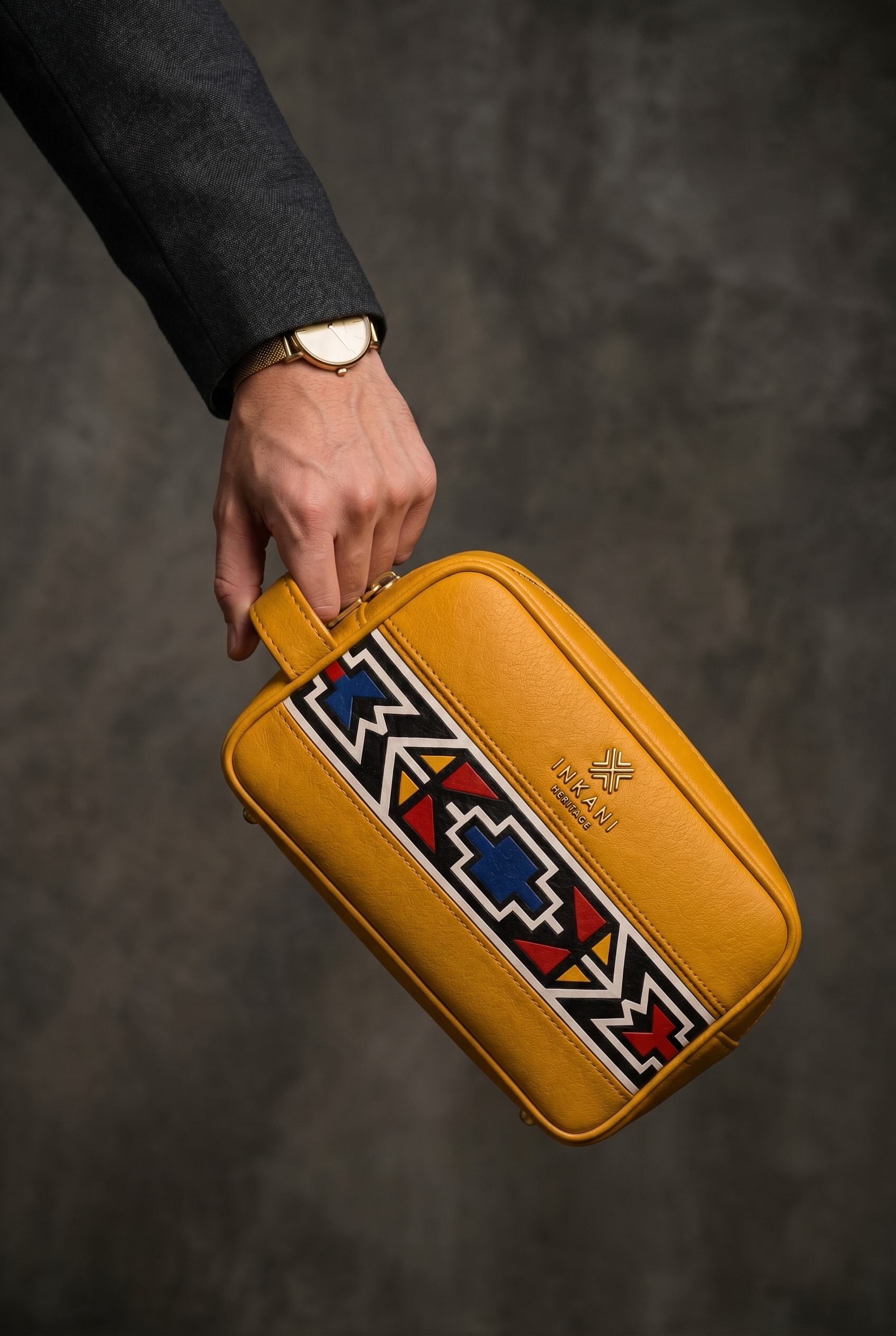 Inkani Heritage yellow toiletry bag with geometric pattern